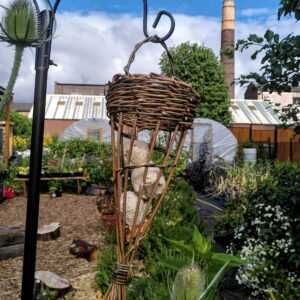 A hanging willow bird feeder.