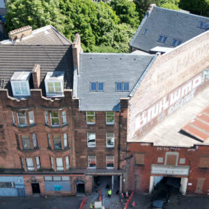 Photograph of a red sandstone building in a terraced row