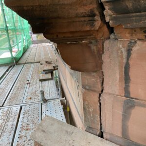 Photograph of a cracked tenement building